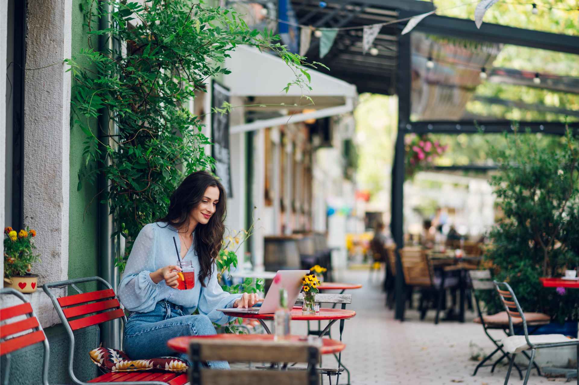 woman-sitting-in-a-street-cafe-and-drinking-cold-b-2025-04-01-13-21-36-utc (1)